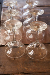 Champagne glasses upside down on wooden table