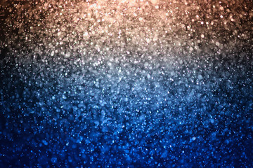 glitter bokeh of light background .Abstract blurred light.blue and gold color