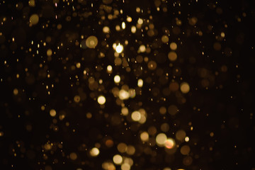 Fototapeta na wymiar Golden glitter bokeh of light.Abstract blurred light