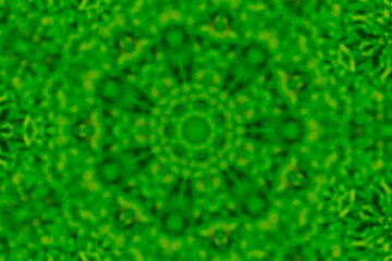Blurred abstract green in asterisk shape pattern for background.