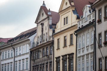 Obraz premium Typical Medieval Facade of an old appartment residential building in a street of old town, the historical center of Prague, Czech Republic, in the most touristic part of the city