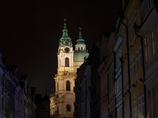 Kostel Svety Mikulase Church (Saint Nicholas) illuminated at night in prague, in the Mala Strana district of Medieval Prague, Czech Republic. It is a Catholic Baroque church