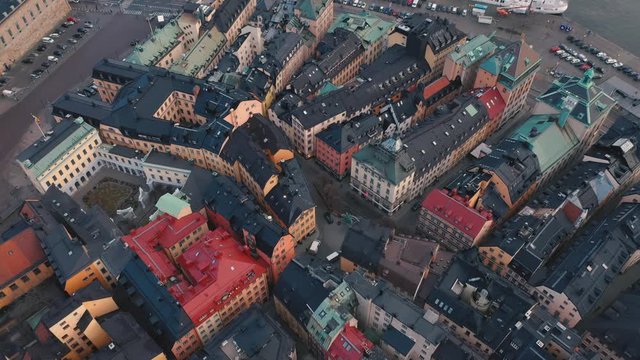 STOCKHOLM, SWEDEN - FEBRUARY, 2020: Aerial view of Stockholm city centre Gamla stan. Flying over buildings in old town.