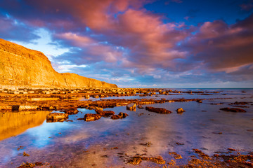 Kimmeridge panorama - glowing golden cliffs illuminated in the sunshine