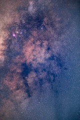 The stars and the milky way in the dark sky at night are very beautiful.