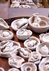 Fototapeta na wymiar Raw bowls and pots in a classroom