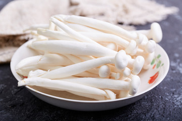 Fresh white mushrooms on a plate