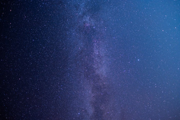 The stars and the milky way in the dark sky at night are very beautiful.