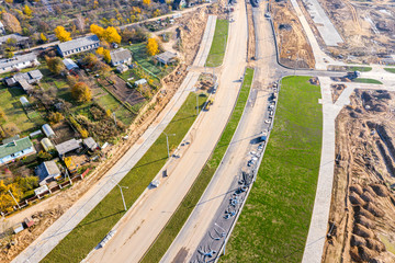 aerial top view on city construction site. construction of new highway at suburb area