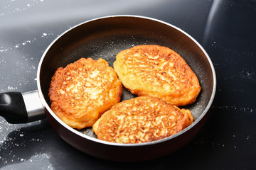 Fritters in a frying pan