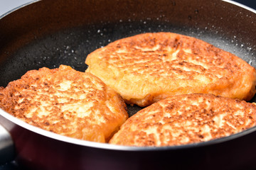 Fritters in a frying pan