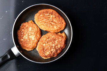 Fritters in a frying pan