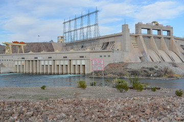 Rapid Changes in Water Level and Do Not Enter the Water sign overlooking the spillway of the Davis Dam in Laughlin, Clark County, Nevada USA