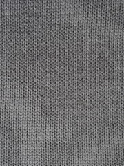 Gray knitted textured background, knit with facial loops. Hand knitting.
