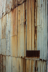 Rusting corrugated iron metal wall ideal as background wallpaper