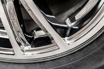 Fragment of a chrome wheel disk close-up.
