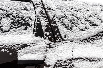 Fototapeta premium The car was completely covered with snow in the backyard.