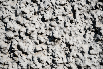 Texture photo of white rough concrete plaster