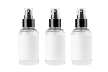 Three spray bottles for cosmetics product with white blank label isolated on white background, mock up for branding, advertising,  design.