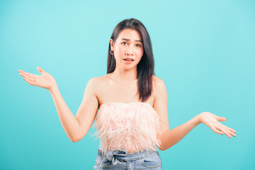 Asian beautiful woman her confused throwing hands aside