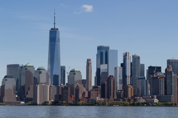 Fototapeta na wymiar New York City Manhattan downtown skyline with boat over Hudson River panorama