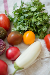 Fresh raw eggplants, tomatoes and parsley