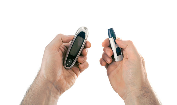 Glucometer and the lancing device in hands It is a tools of home blood glucose monitoring (HBGM) by people with diabetes mellitus or hypoglycemia.