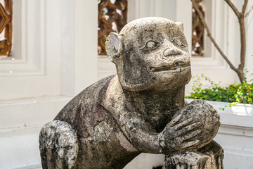 The Chinese monkey stone statues At Wat Pho or Phra Chetuphon Wimon Mangkararam Temple an ancient temple in Bangkok, Thailand