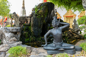 The Hermit statue At Wat Pho or Phra Chetuphon Wimon Mangkararam Temple an ancient temple in Bangkok, Thailand