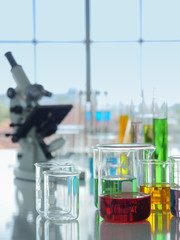 A group of beakers  and other lab equipment