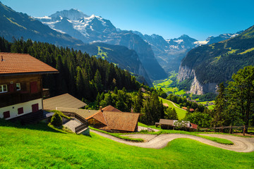 Alpine wooden houses on the hill with great view, Switzerland