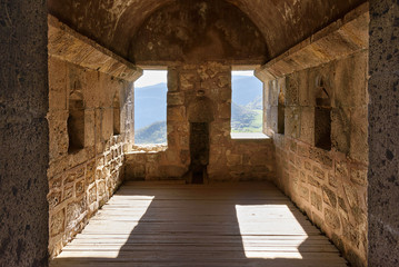 Empty room of ancient monastery with mountain views