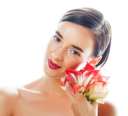 young pretty brunette woman with red flower amaryllis close up isolated on white background. Fancy fashion makeup, bright lipstick, creative Ombre manicured nails. spa skin care