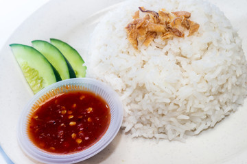 Asian Food - White Rice, Sambal and Cucumber on a plate. Isolated on white
