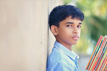 Portrait of Indian little school boy posing to camera