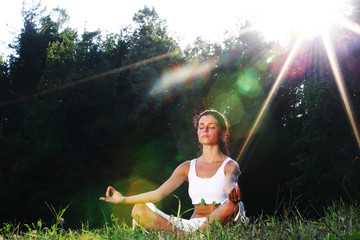 Woman doing yoga in the park