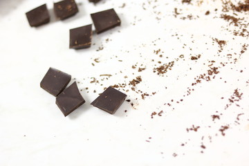 Broken chocolate bar and grated chocolate