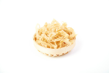 Dried bean skin in a bamboo basket
