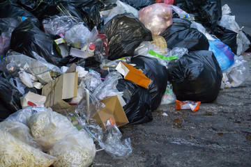 Dumpsters being full with garbage in the evening