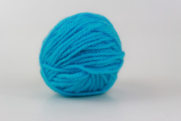 Cyan yarn closeup isolated on white background