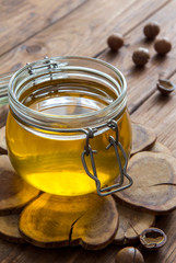 Ghee in liquid form on a wooden table