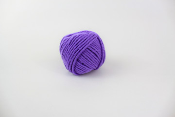 Purple yarn isolated on white background