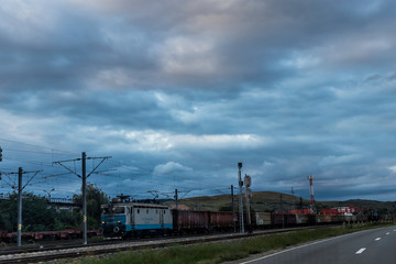 Train carrying wheat in an overcast day