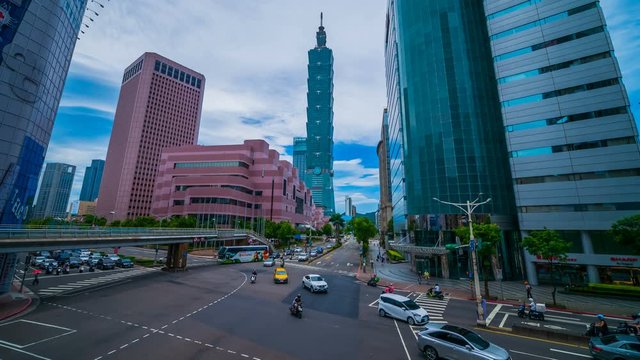 Taipei 101 tower with traffic on road in Taipei, Taiwan