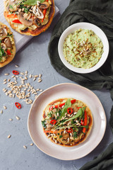 Warm, spicy Pitta, crunchy red peppers and meaty mushroom mix, parsley and sunflower seeds make this an epic toast with hummus and avocado.