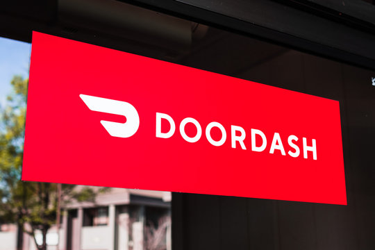 Feb 27, 2020 Santa Clara / CA / USA - Close up of Doordash logo and symbol displayed at the entrance to one of their offices; DoorDash Inc. is a on-demand prepared food delivery service