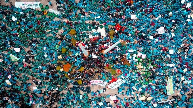 Top View of Huge students demonstration with blue shirt who rejected the policies of the Indonesian government