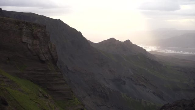 Canyon and Mountain peak during ah storm and dramatic, colorful sunset on the Fimmvorduhals Hiking trail near Thorsmork