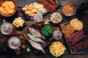 Set of appetizers and salty beer snacks. Pile of food for big company. Party, sport bar, pub, restaurant menu