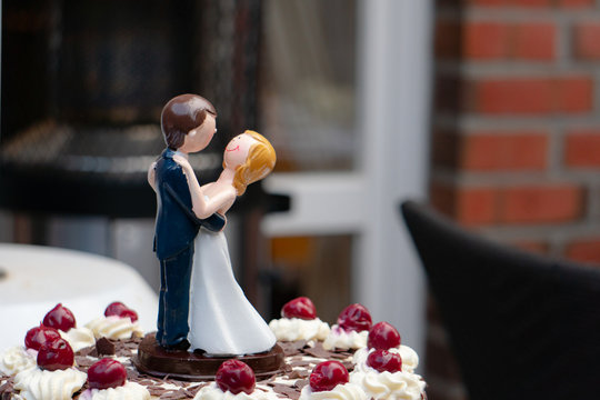bride and groom on a cake